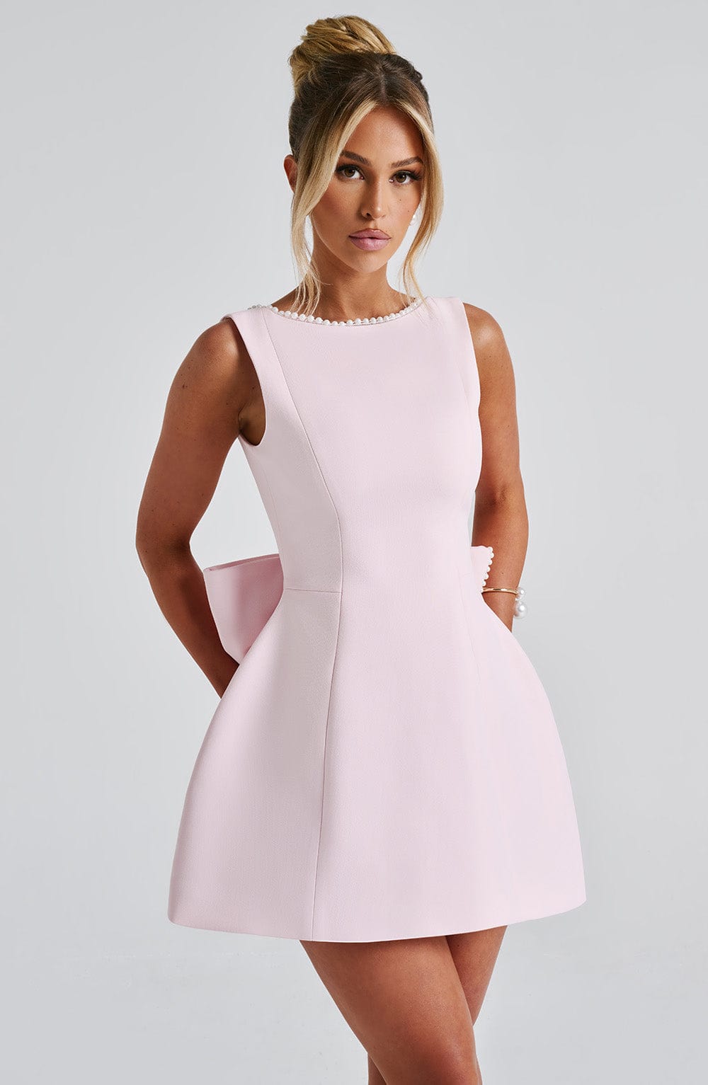 Chic Mini Dress | Pearl-Trimmed Neckline & Dramatic Back Bow | Elegant Daytime Wear 3